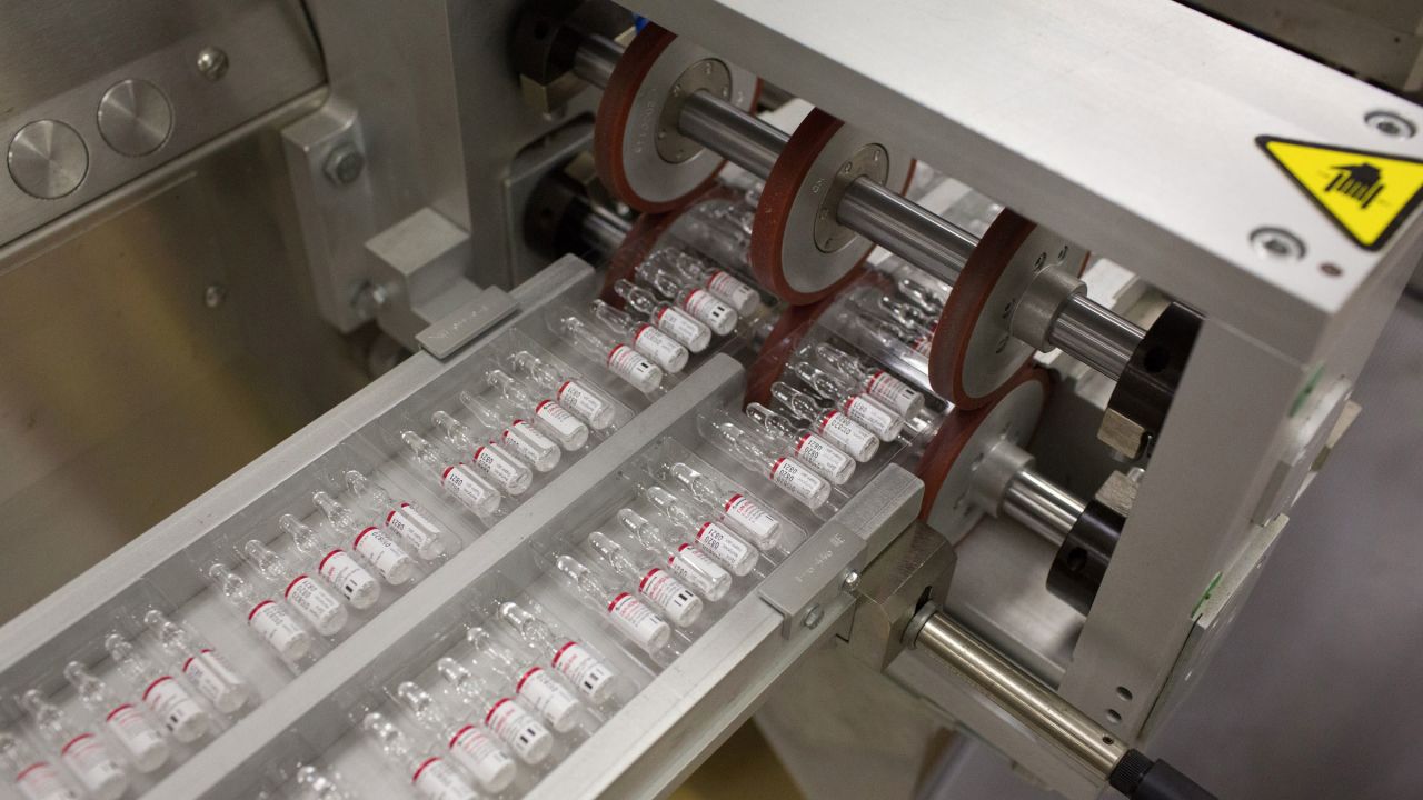 Ampoules containing a vaccine component pass through a packaging machine in Zelenograd, Russia, on Friday.
