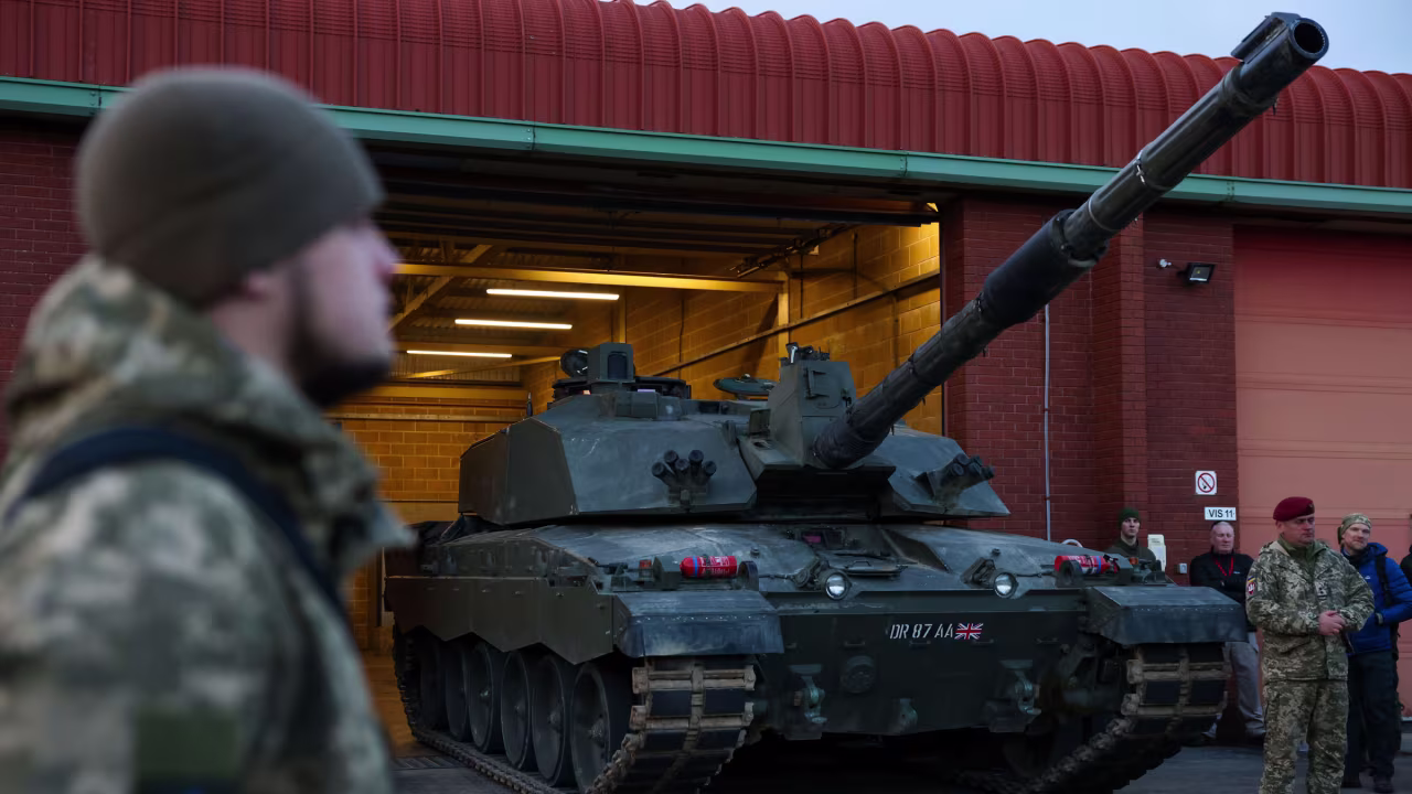 Tank crews from Ukraine's armed forces, being trained to use a Challenger 2 battle tank by members of the British Army, prepare to meet Ukrainian President Volodymyr Zelensky and UK Prime Minister Rishi Sunak at the Lulworth Camp in Burngate, England, on February 8.