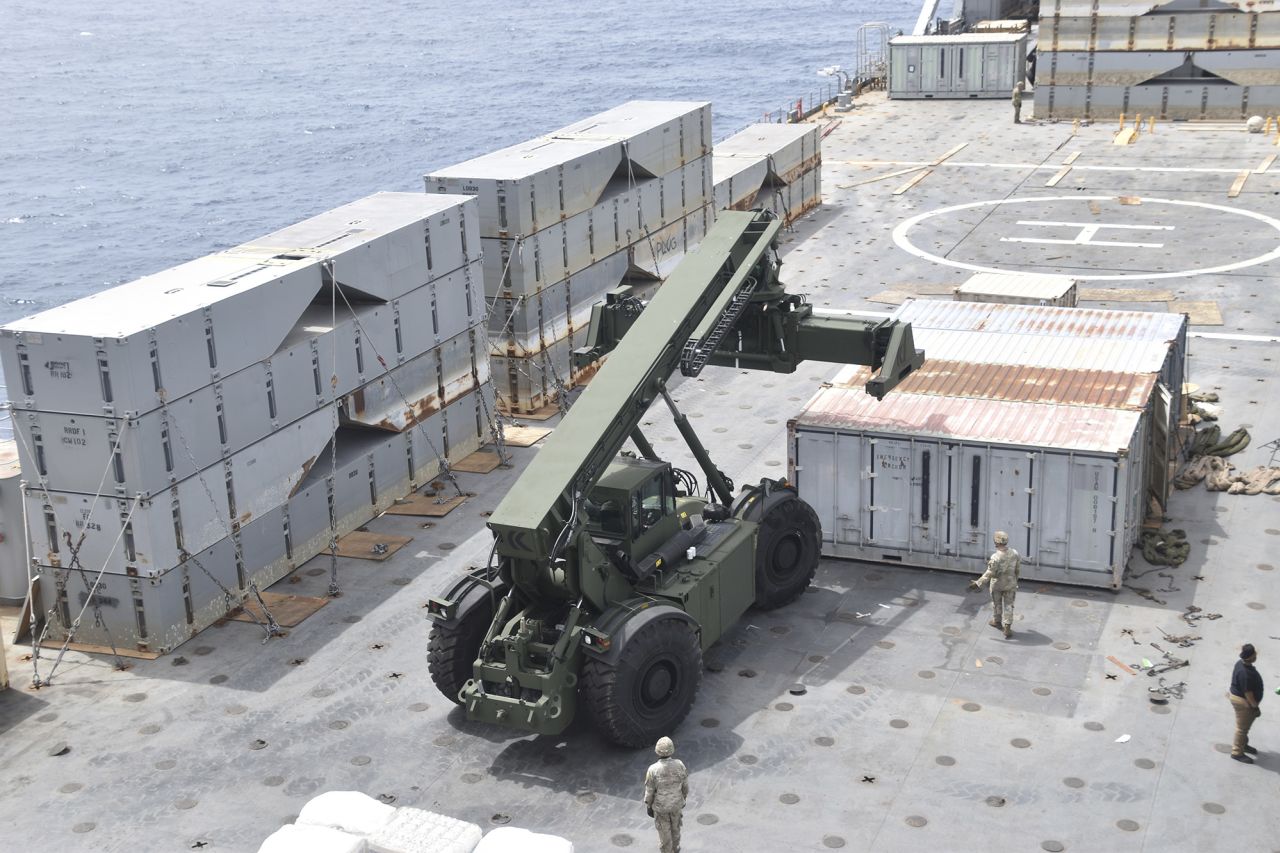 In this image provided by the U.S. Army, soldiers assigned to the 7th Transportation Brigade (Expeditionary) and sailors attached to the MV Roy P. Benavidez assemble the Roll-On, Roll-Off Distribution Facility (RRDF), or floating pier, off the shore of Gaza on April 26.