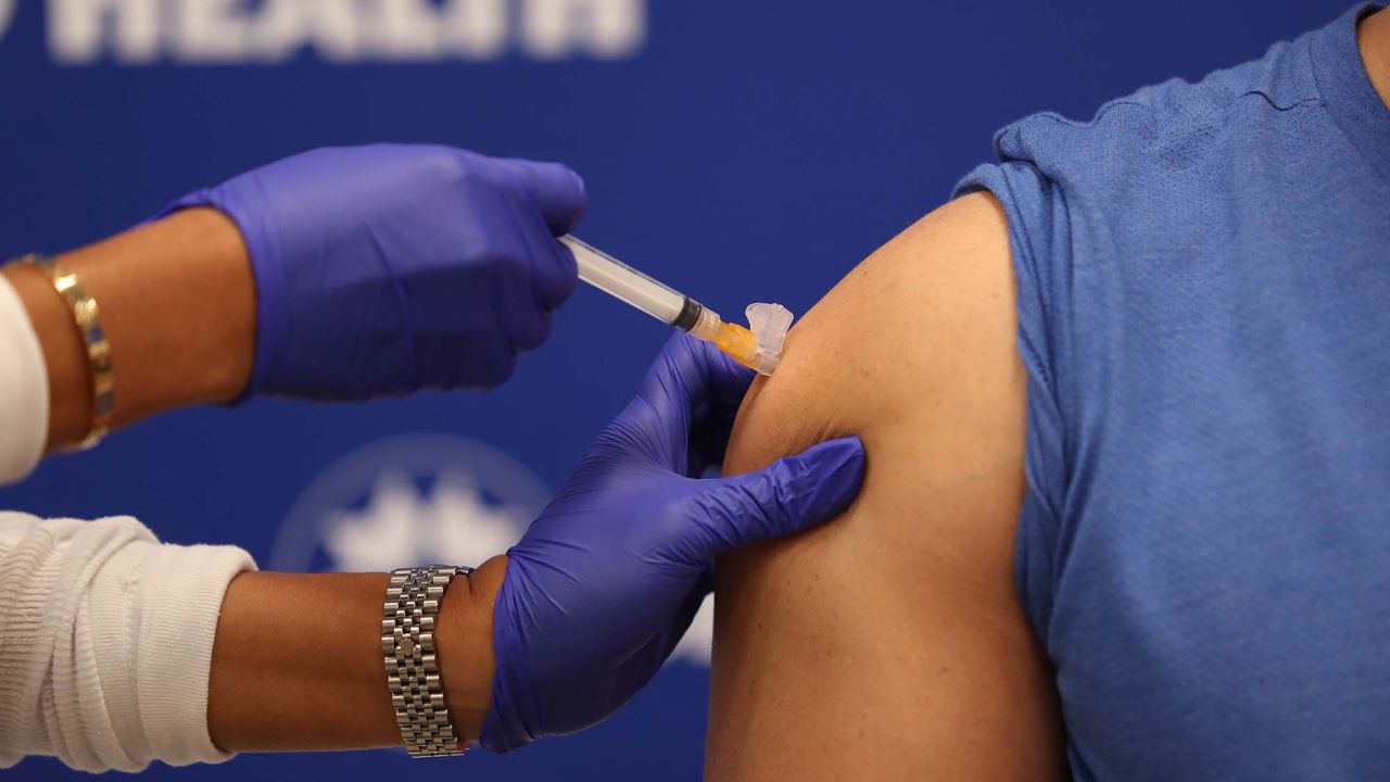 Nurse Leonida Lipshy gives Dr. Nadav Fields a shot of the Moderna Covid-19 vaccine on December 23, in Fort Lauderdale, Florida.