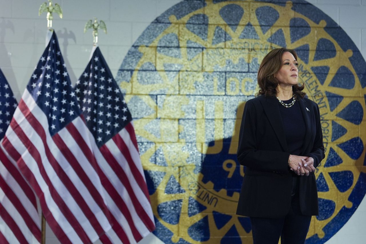 Vice President Kamala Harris arrives to speak at a campaign rally on August 8, in Wayne, Michigan, with Democratic vice presidential nominee Minnesota Gov. Tim Walz. 