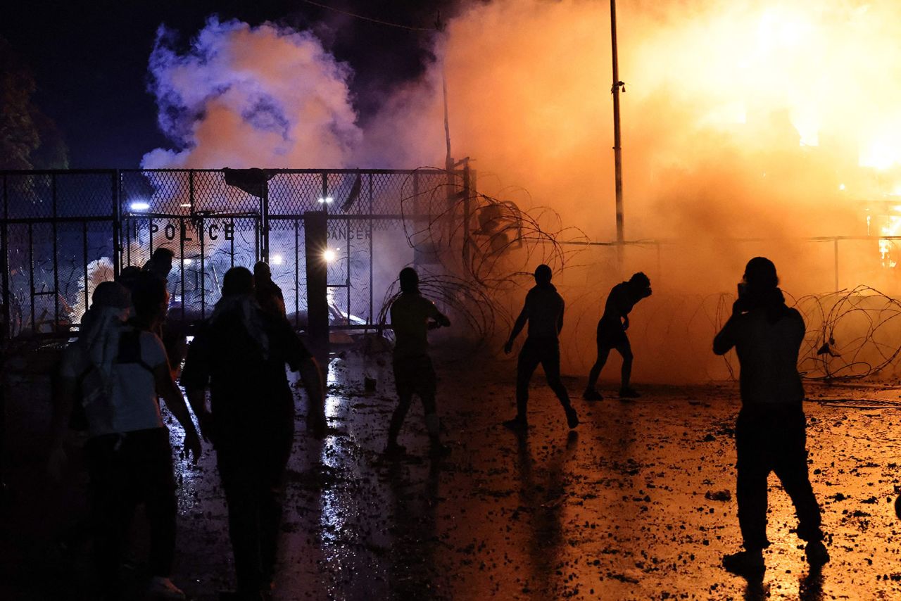 Protesters clash with Lebanese security forces on early on Wednesday, October 18, 2023, outside the US Embassy in Awkar, Lebanon.