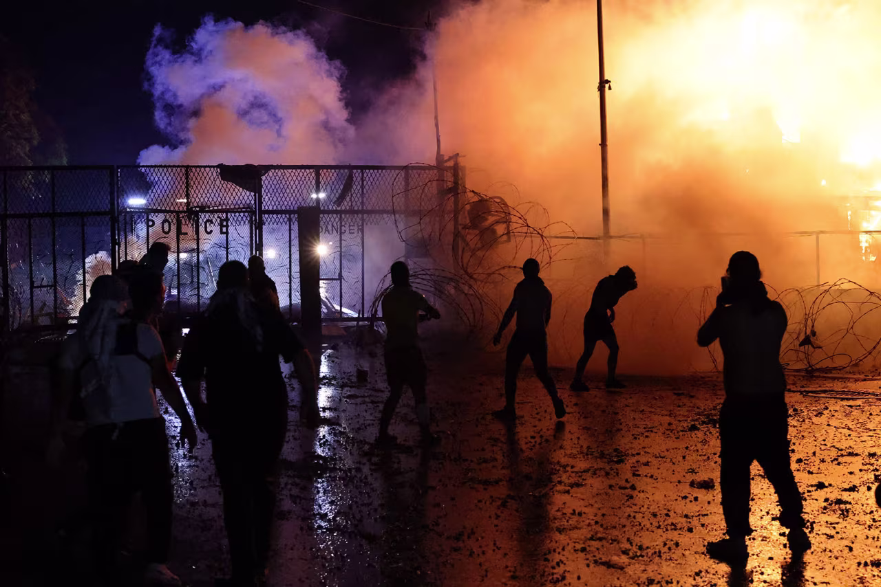 Protesters clash with Lebanese security forces on early on Wednesday, October 18, 2023, outside the US Embassy in Awkar, Lebanon.