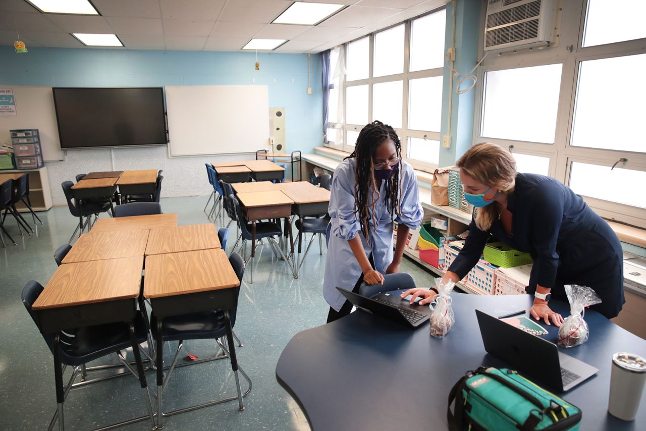 Jasmine Gilliam and Lucy Baldwin, teachers at King Elementary School, prepare to teach their students remotely in empty classrooms during the first day of classes on September 8, in Chicago.