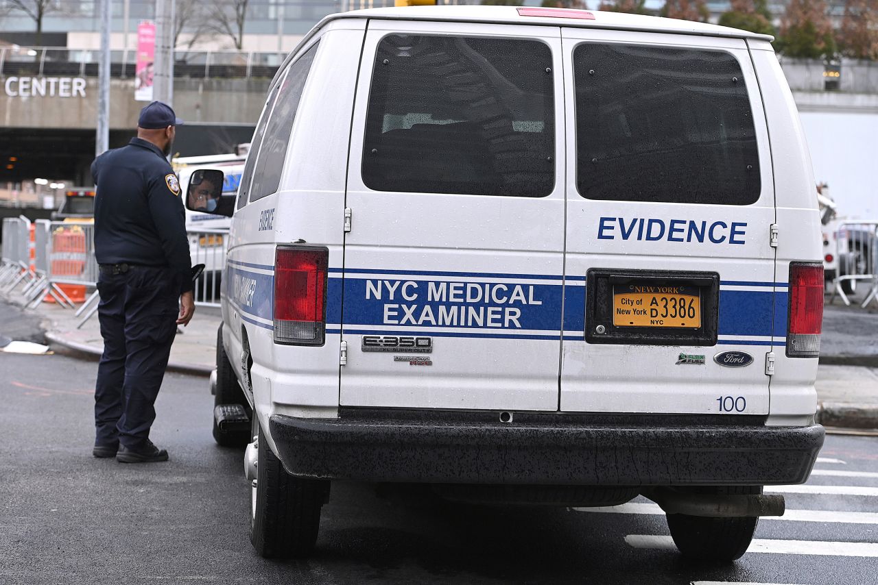 An NYC Medical Examiner van is parked along the street where members Air Force Reserve build a makeshift morgue outside Bellevue Hospital in New York City on March 25.