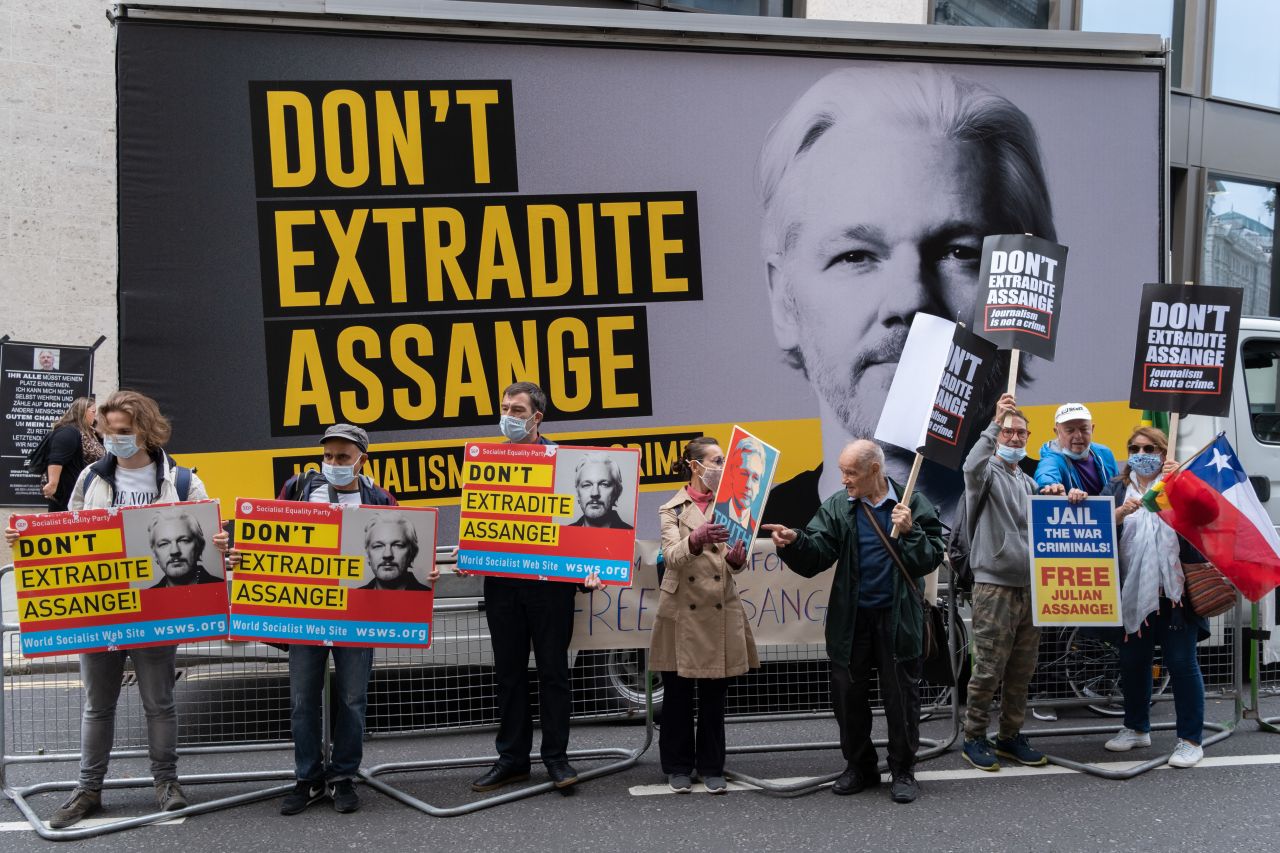 Supporters of Wikileaks founder Julian Assange protest outside London's Old Bailey court on September 7.