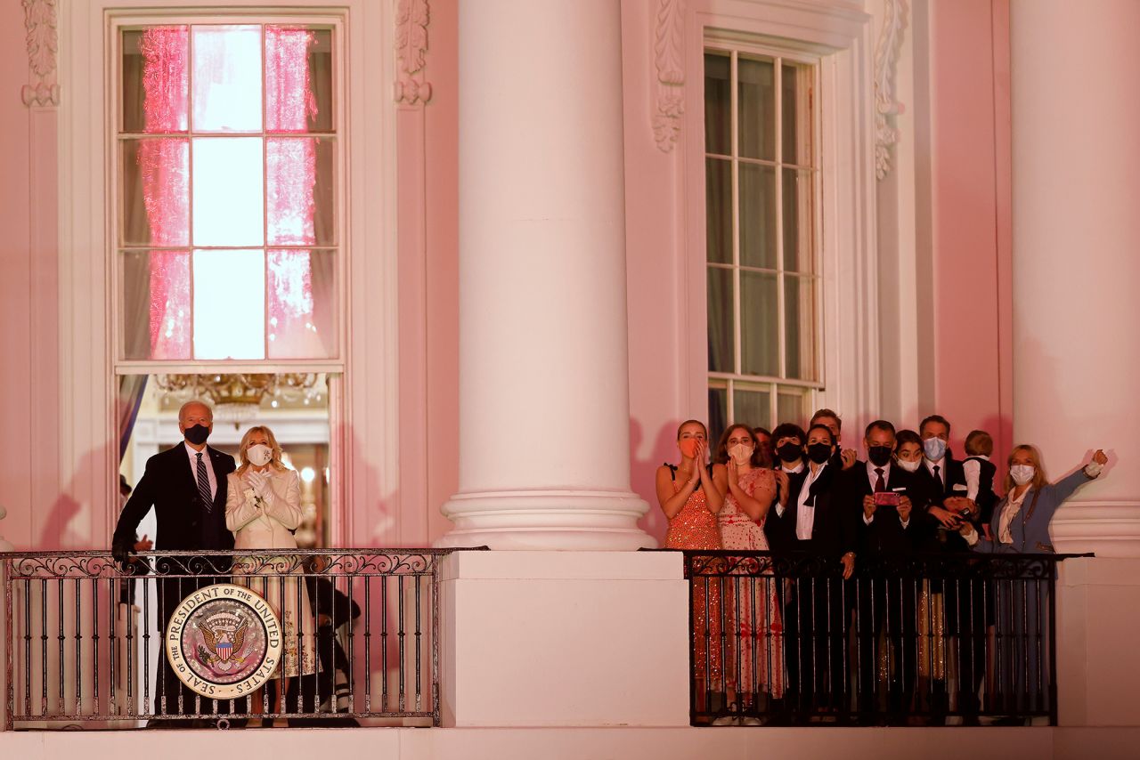 President Joe Biden, first lady Jill Biden, and their family watch fireworks from the White House after his inauguration as the 46th President of the United States on January 20.