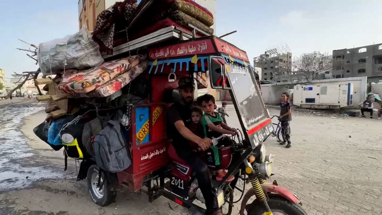 In this video still, a man drives with his children and their belongings on May 11.