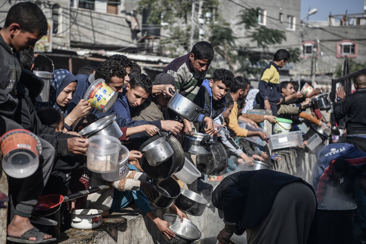 Palestinians receive food and humanitarian aid in Rafah, Gaza on December 19.