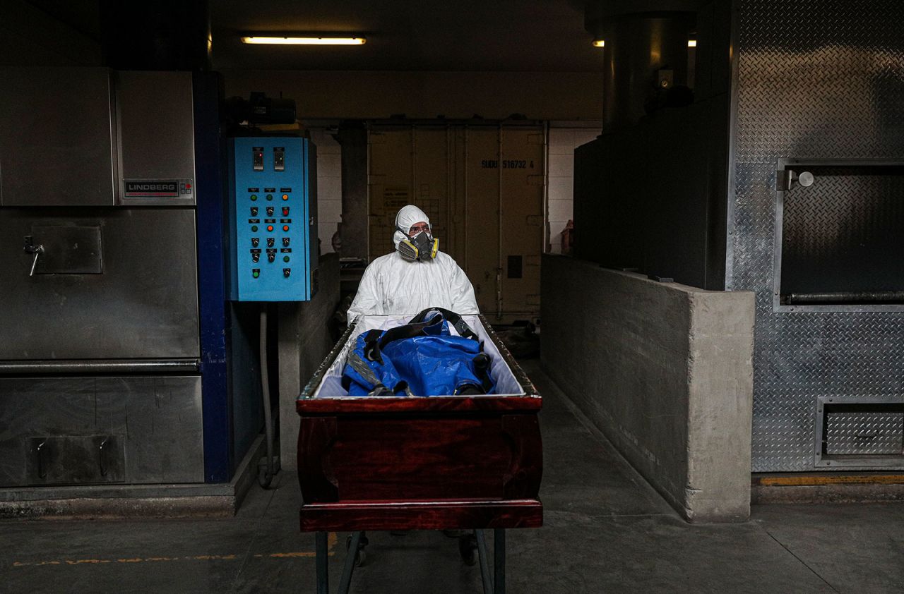 An employee at La Recoleta Crematorium in Santiago, Chile, prepares to cremate the body of a coronavirus victim on Friday, June 26. More than 500,000 people worldwide have died from the novel coronavirus, according to Johns Hopkins University's tally.