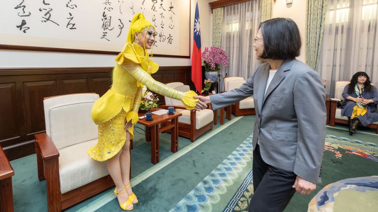 Taiwanese drag queen Nymphia Wind shakes hands with Taiwan's outgoing leader Tsai Ing-wen at the presidential office in Taipei, Taiwan on May 15, 2024.