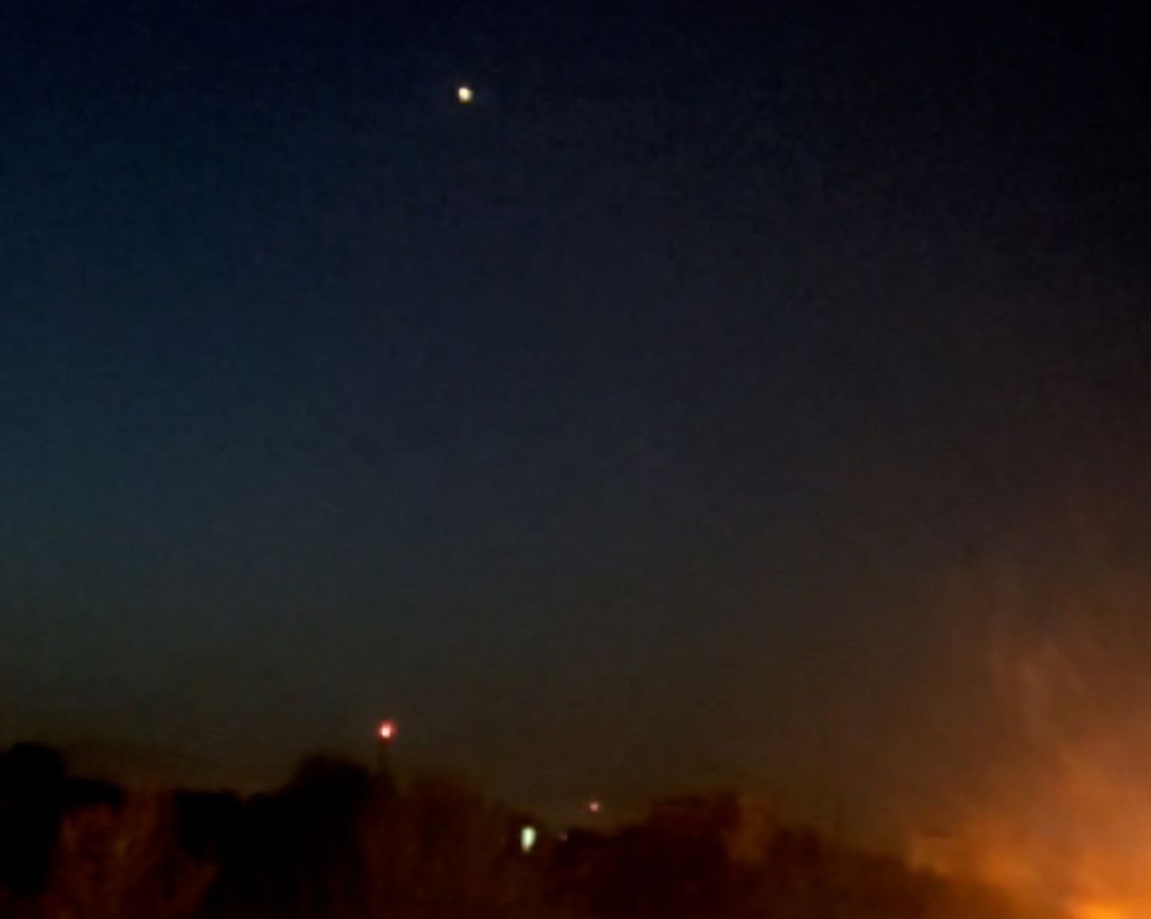 A still taken from video shows flashes in the sky near Isfahan, Iran, on April 19. CNN cannot verify the authenticity of video.