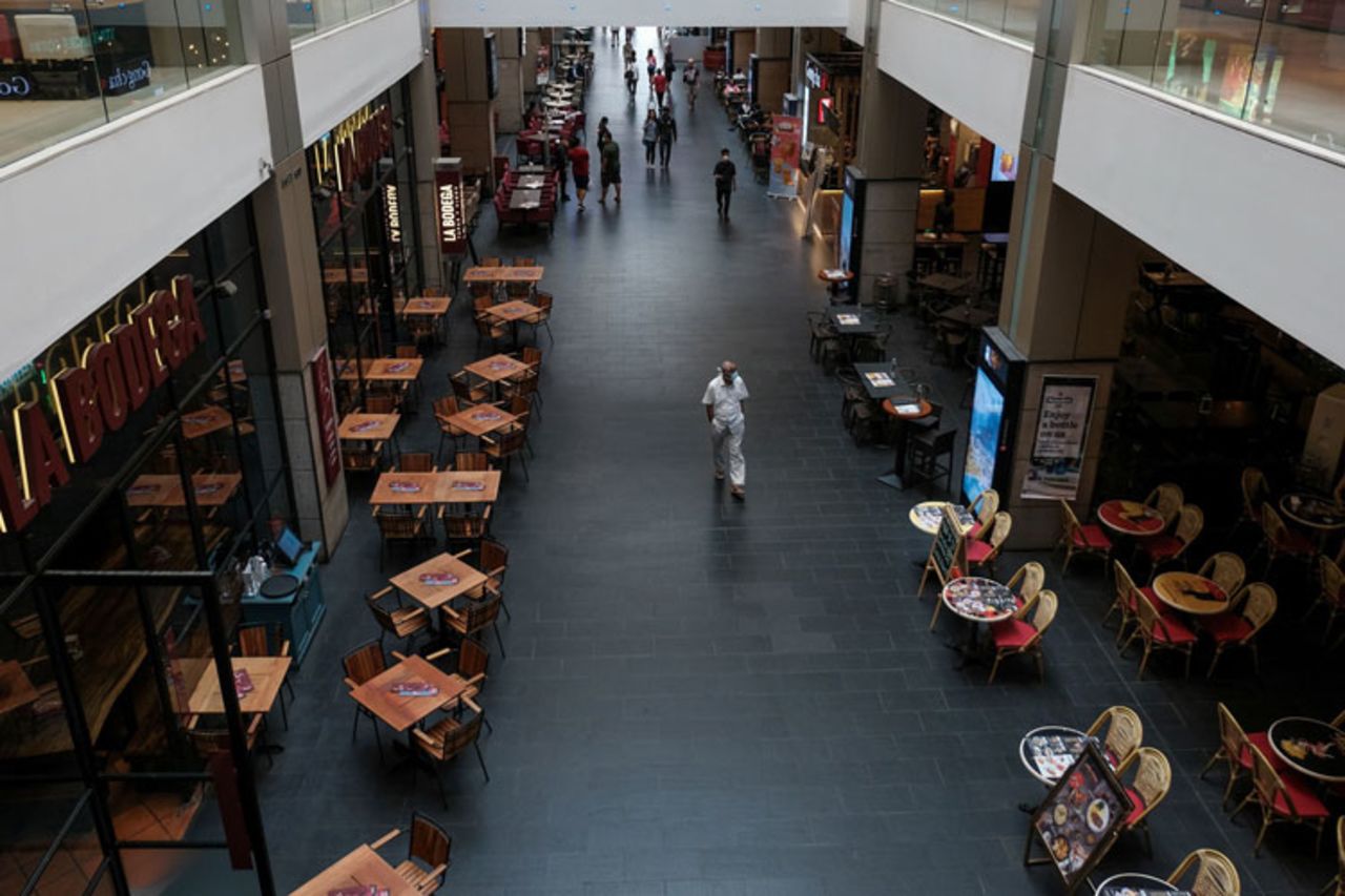 A man wearing a face mask amid concerns over the spread of the coronavirus walks through an unusually empty shopping mall in Kuala Lumpur on March 16.