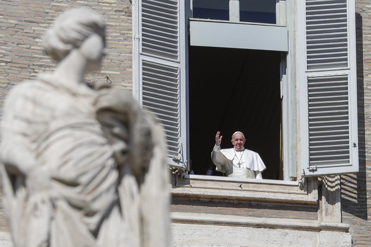 Pope Francis waves from a window overlooking St. Peter's Square at the Vatican on March 8.