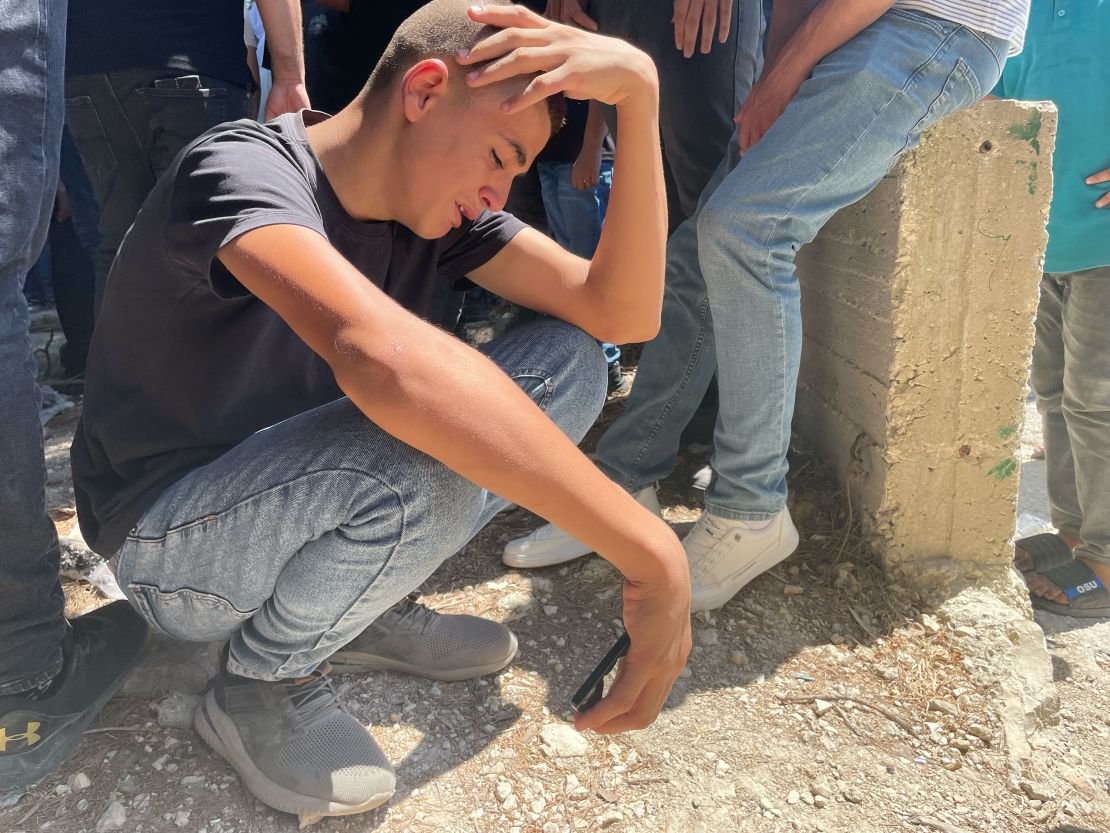 A cousin cries during Sedda's burial in the West Bank town of Jit on Friday.