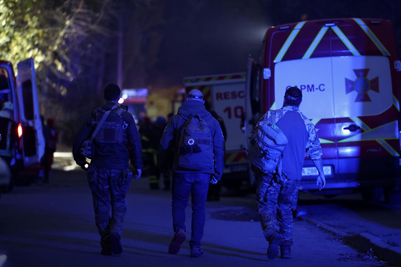 Rescue workers at the scene of a missile strike in the Pecherskyi district on November 15, in Kyiv, Ukraine. 