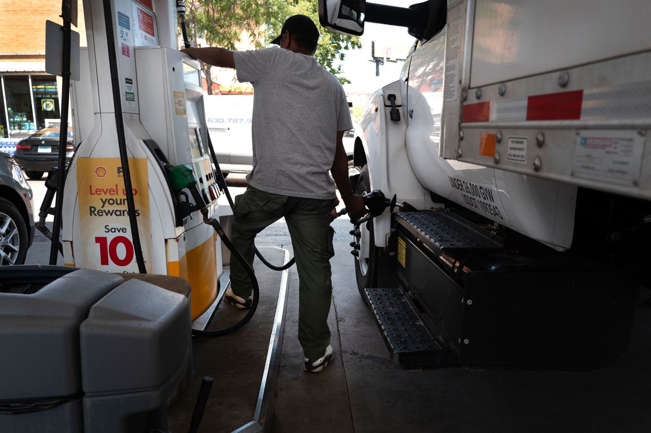 Rodney Vassel puts gas in a truck at a station on June 11 in Chicago.?