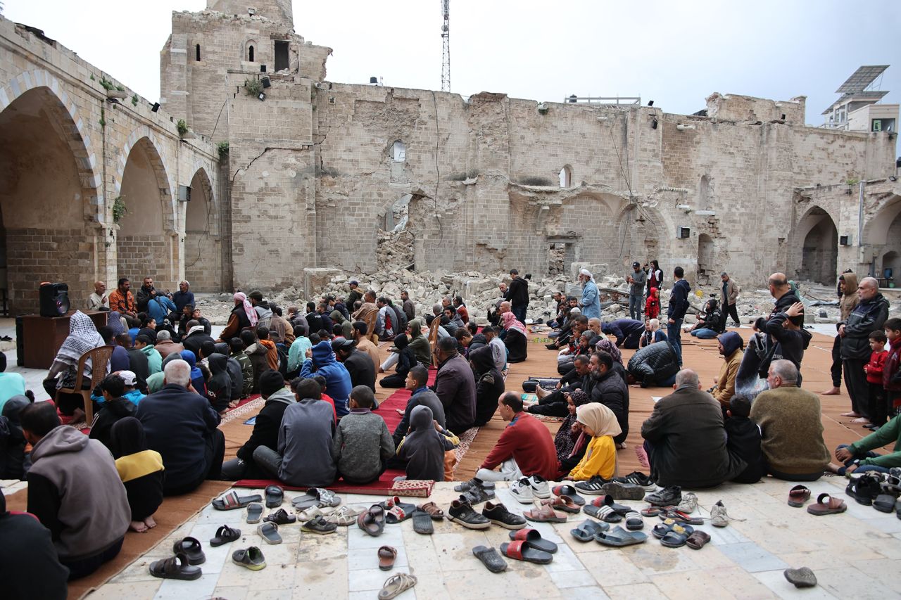 Palestinian worshippers gather on April 10 in the courtyard of Gaza City's historic Omari Mosque to mark the end of the Islamic fasting month of Ramadan. 