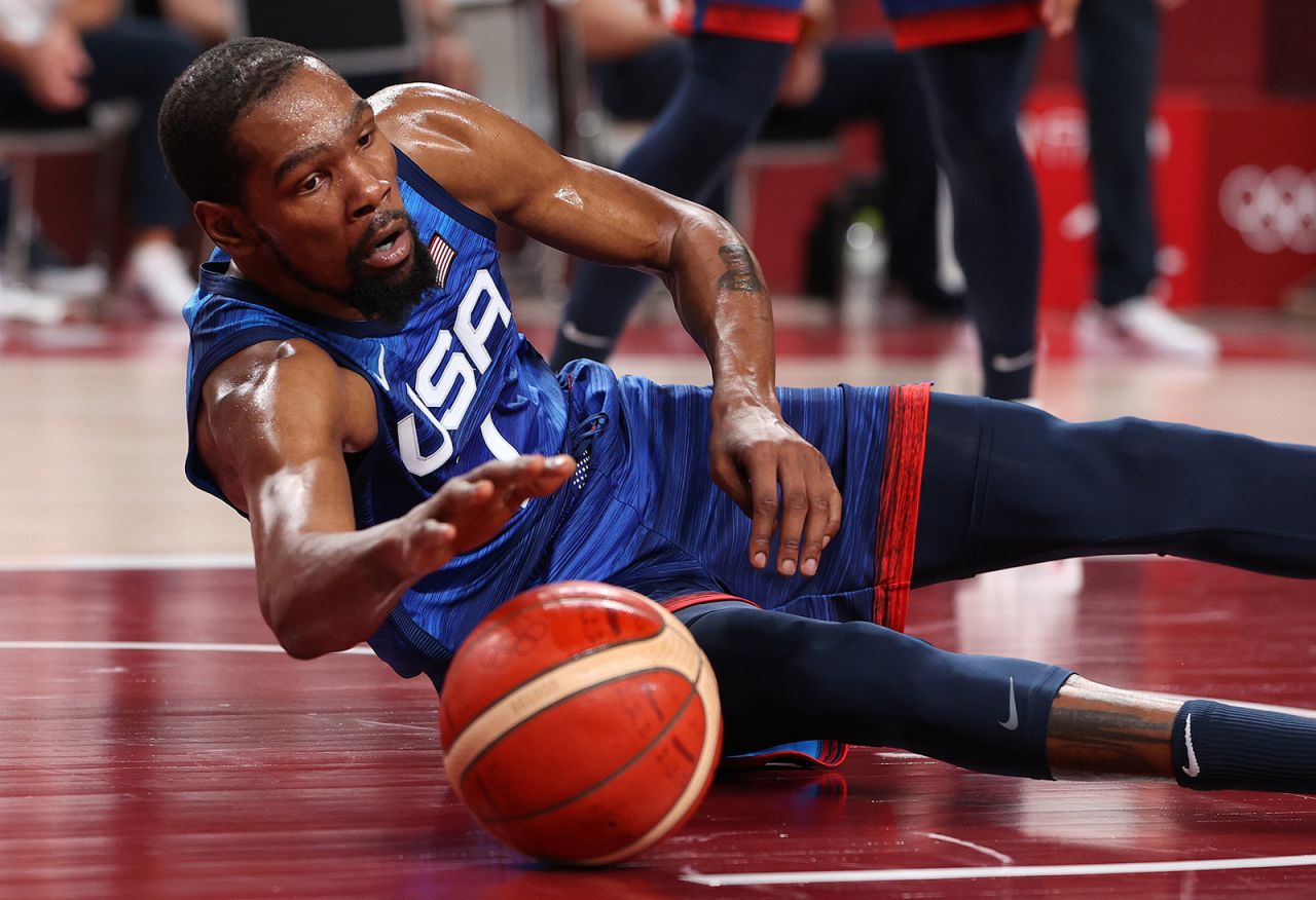 Team USA's Kevin Durant dives for a loose ball against Spain during the second half of their men's basketball quarterfinal at the Tokyo 2020 Olympic Games at Saitama Super Arena on Tuesday. 