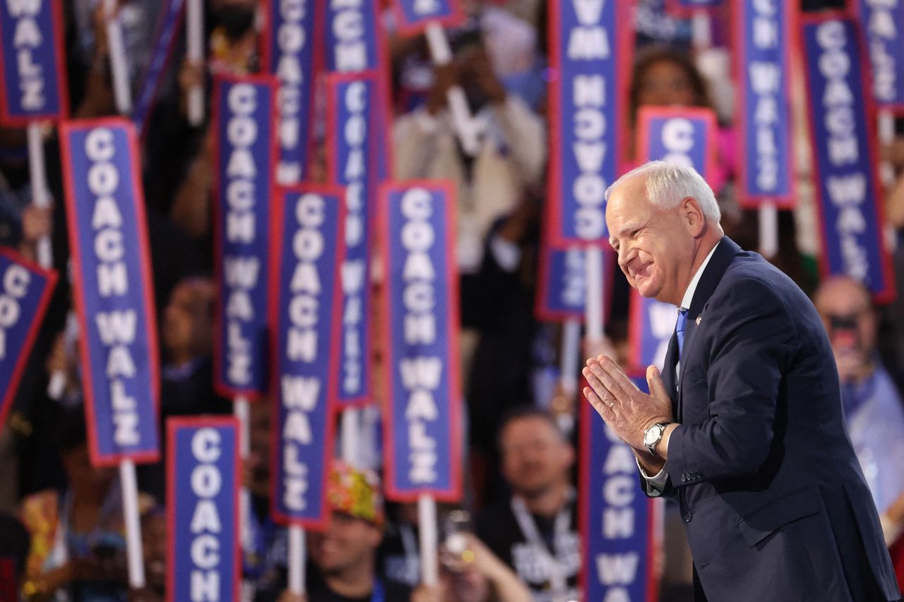 Democratic vice presidential nominee Minnesota Governor Tim Walz takes the stage of the Democratic National Convention  at the United Center, in Chicago, on August 21.