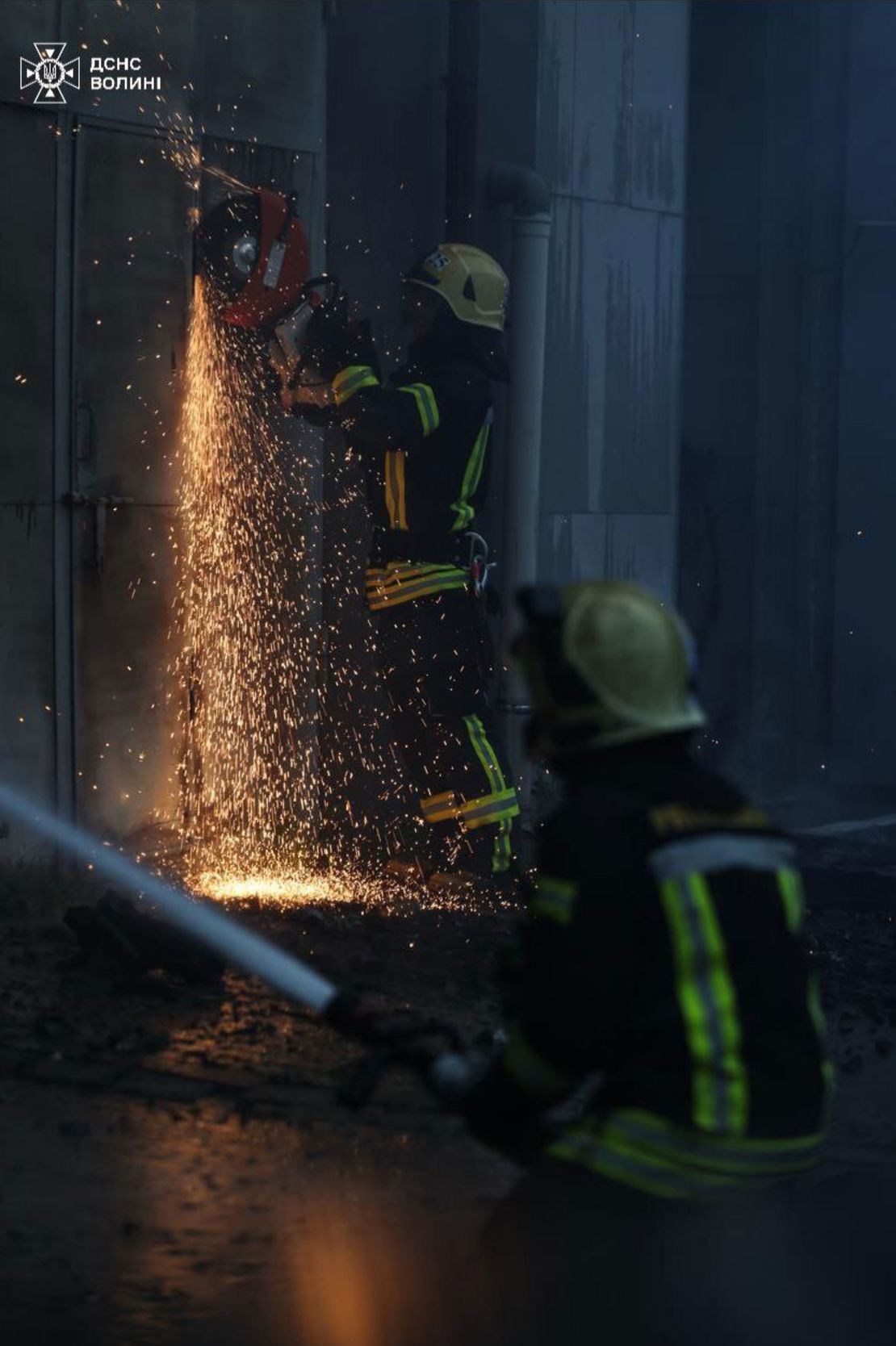 In this image shared to Telegram on July 9, 2025, firefighters work the site of a Russian missile strike in Lutsk, Ukraine.