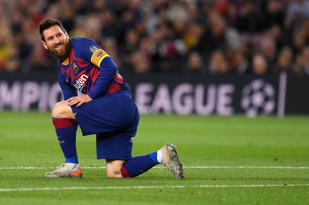 Messi reacts after seeing his curling effort hit the woodwork.