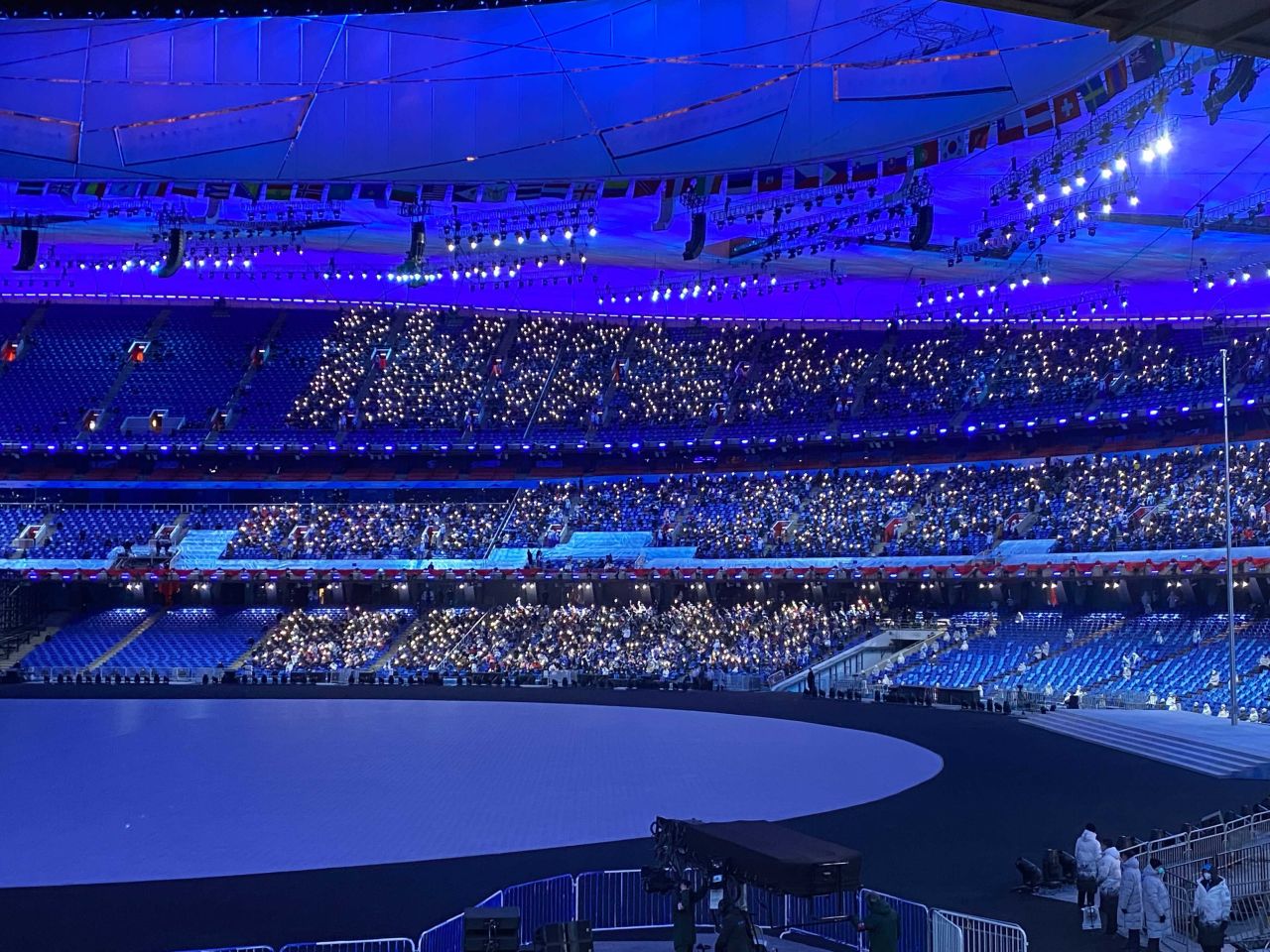 The view inside the stadium as spectators are encouraged to wave torches in the air. 