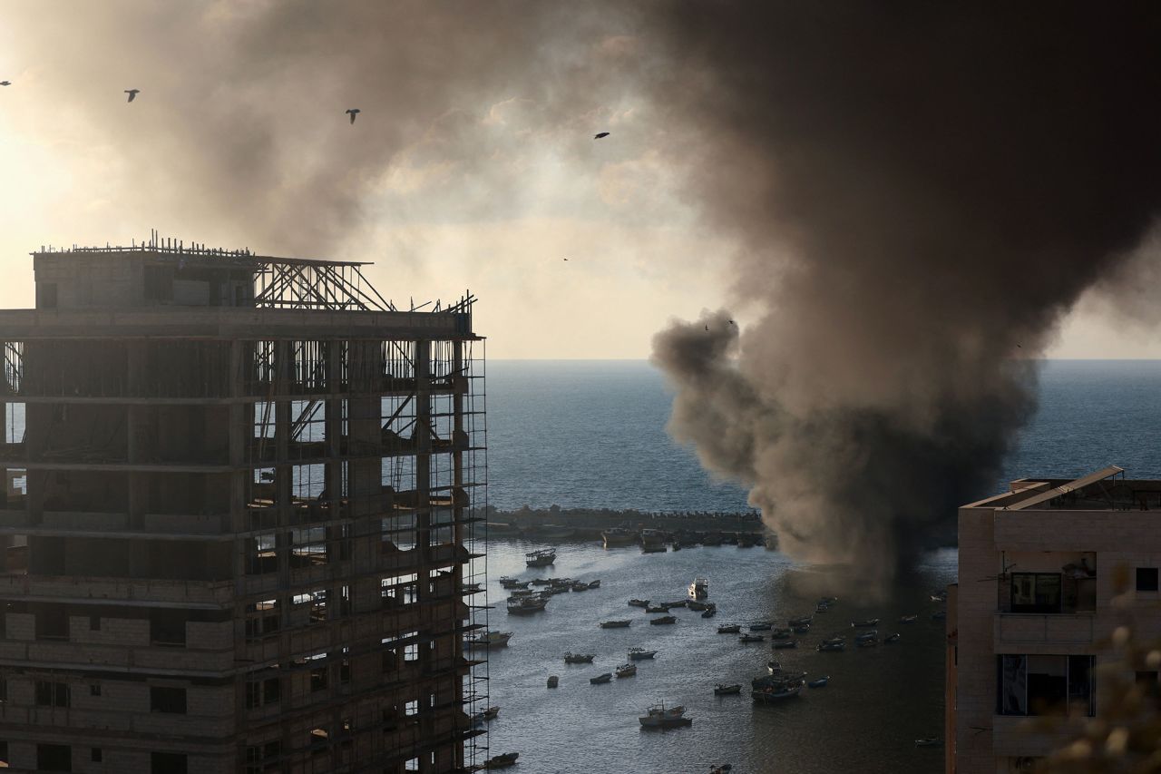 Smoke billows after a strike by Israel on the port of Gaza City on October 10.