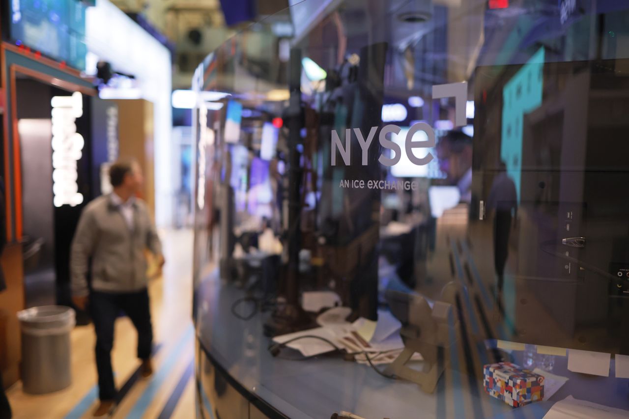 Traders work on the floor of the New York Stock Exchange during morning trading on November 1.