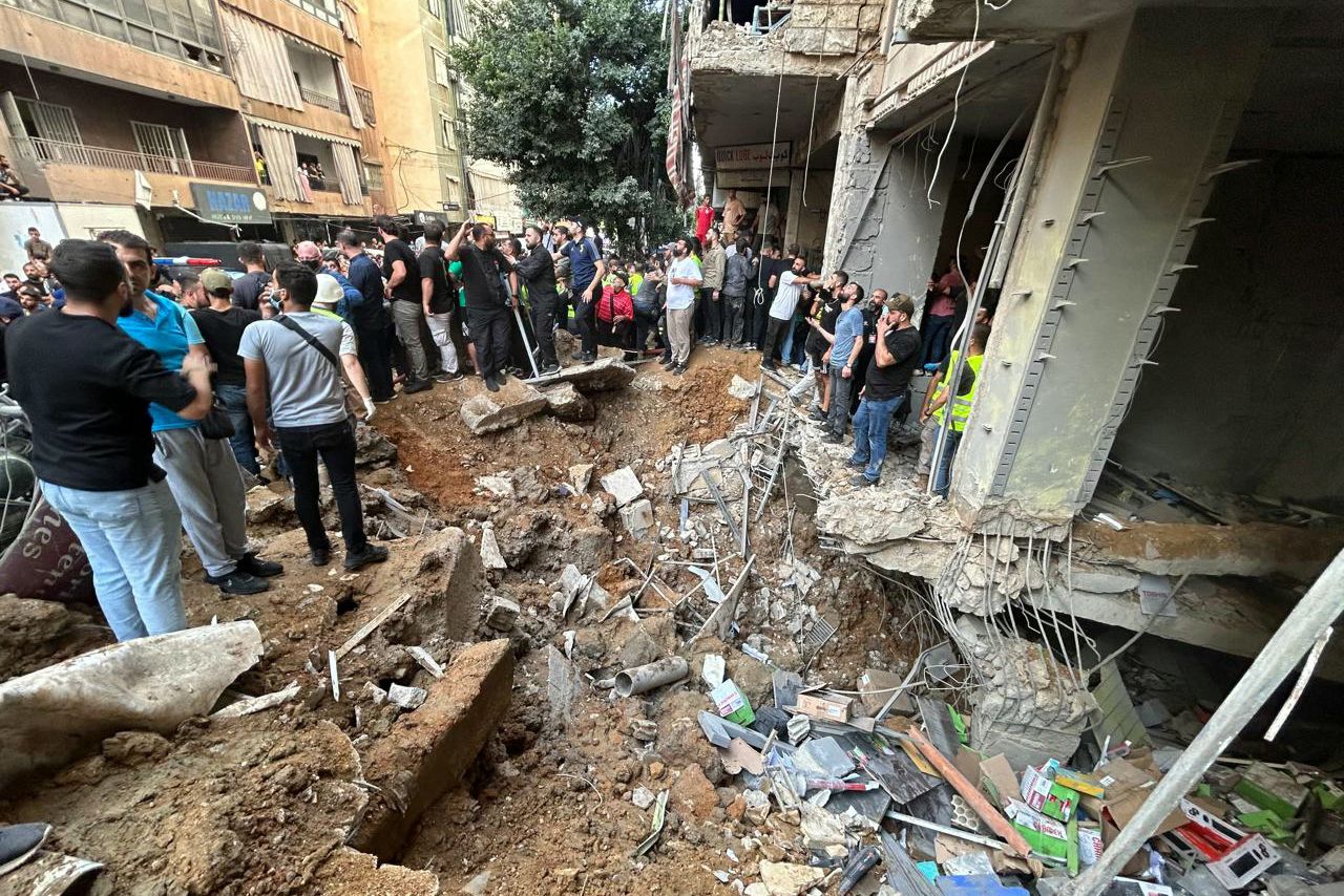 People check the damage at the scene of an Israeli strike in Beirut's southern suburbs on September 20.