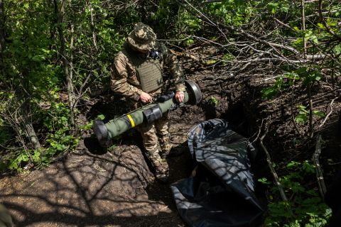 A Ukrainian Army soldier places a US-made Javelin missile in a fighting position on the frontline on May 20, 2022, in Kharkiv Oblast, Ukraine. 