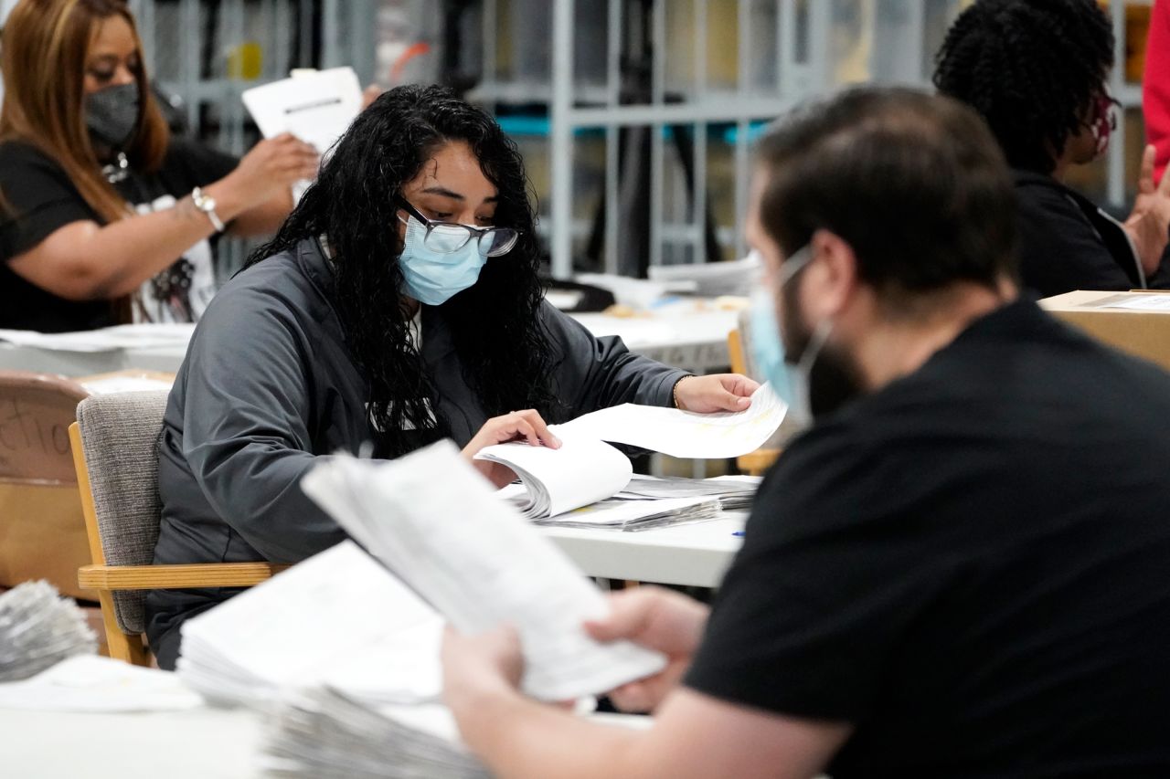 Officials work on ballots at the Gwinnett County Voter Registration and Elections Headquarters on November 6 in Lawrenceville, Georgia. 