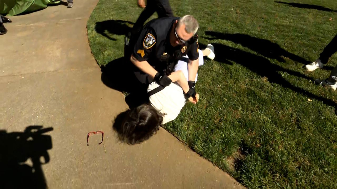 Emory University economics professor Caroline Fohlin is detained by police on Thursday at Emory University in Atlanta. 