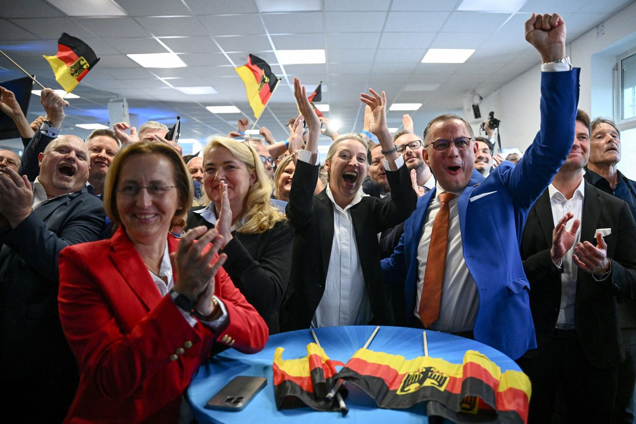 Alternative for Germany (AfD) party co-leaders Alice Weidel, center, and Tino Chrupalla, right, react to results after the polls closed in the European Parliament elections in Berlin on June 9.