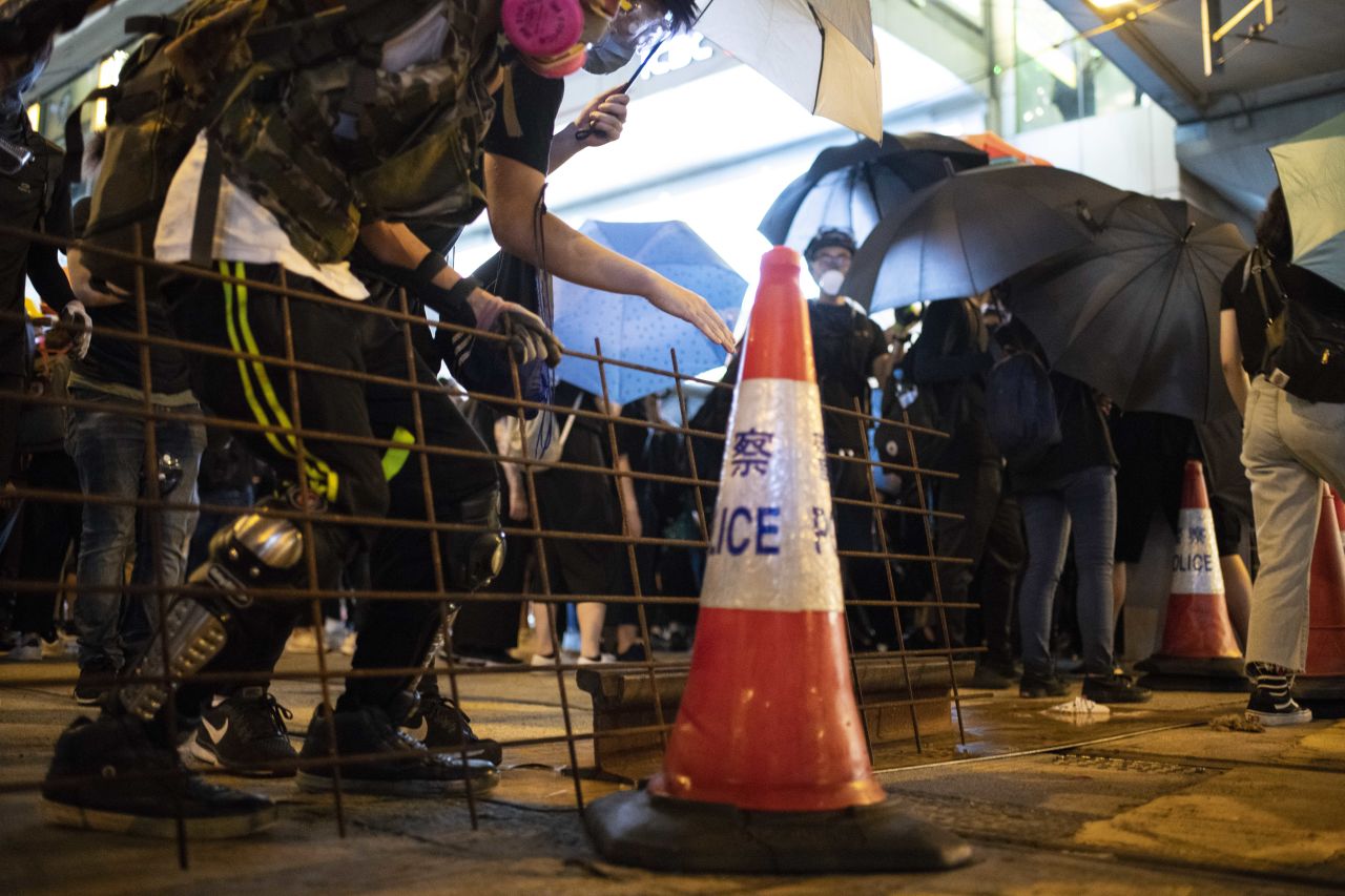 Protesters set impromptu barricades in Causeway Bay Sunday night.