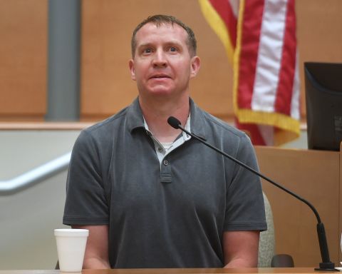 Robbie Parker describes being confronted on the street by a follower of Infowars conspiracy theories during his testimony in Alex Jones' defamation trial in Waterbury, Connecticut, on September 29.