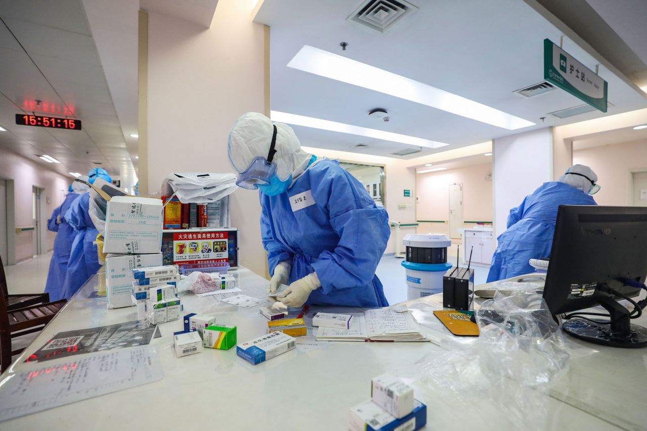 Healthcare staff prepare medicine for a coronavirus patient at the Xiehe hospital in Wuhan on March 7. 