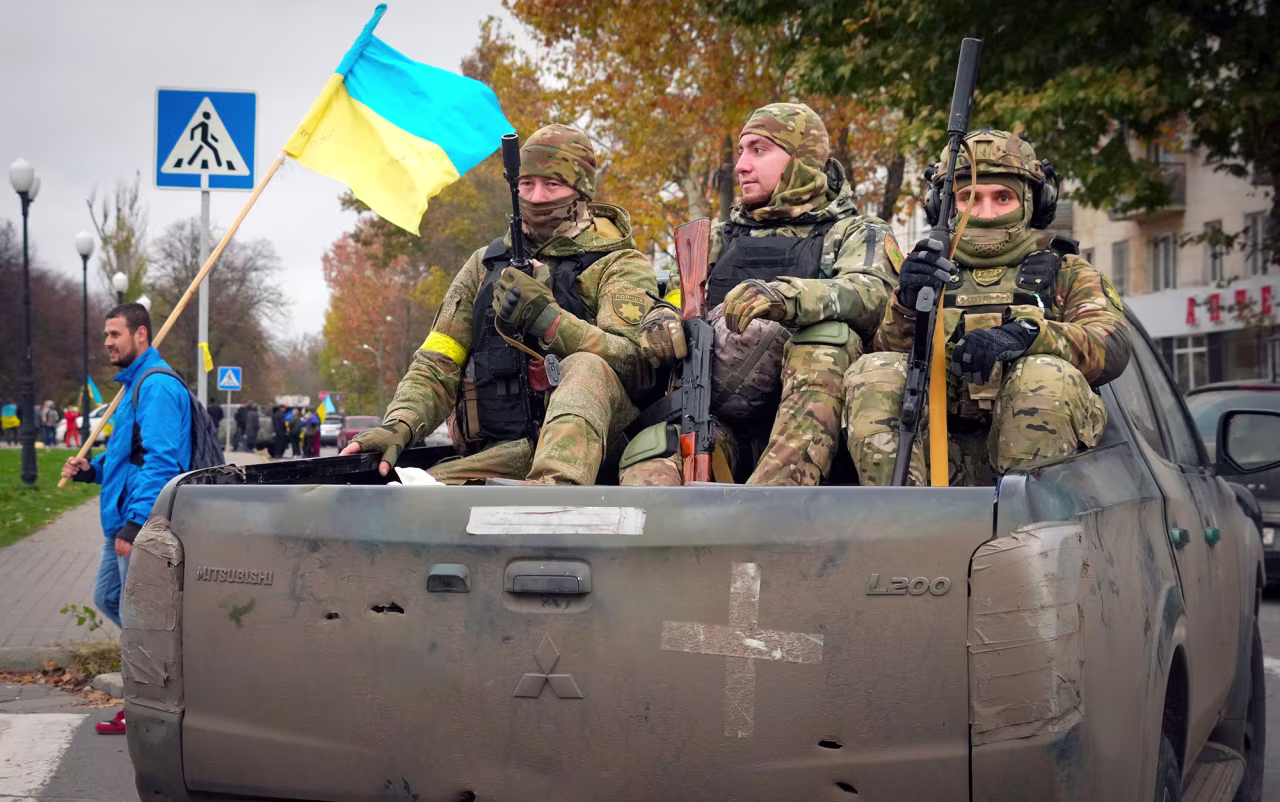 Ukrainian soldiers sit in a truck in Kherson, Ukraine, on November 13. 