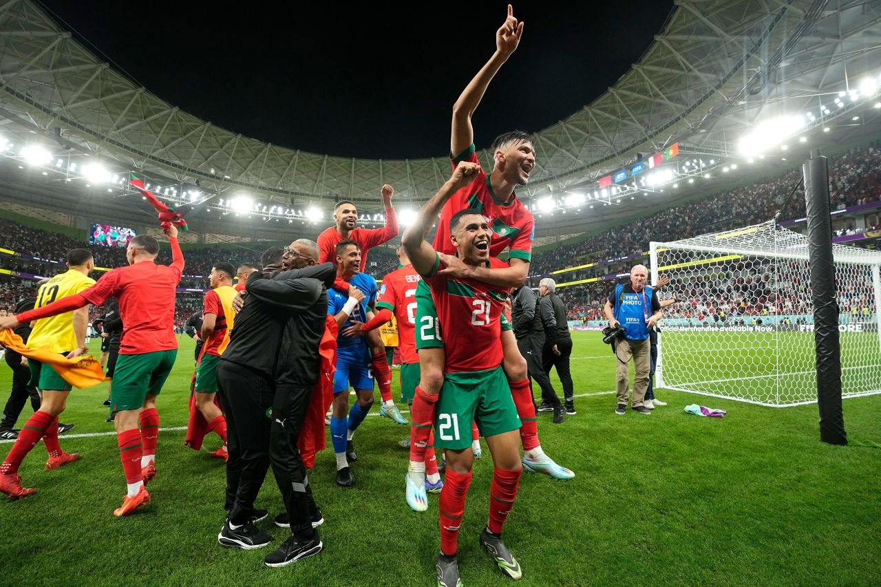 Morocco's players celebrate after winning the World Cup quarterfinal match against Portugal on Saturday, December 10. 