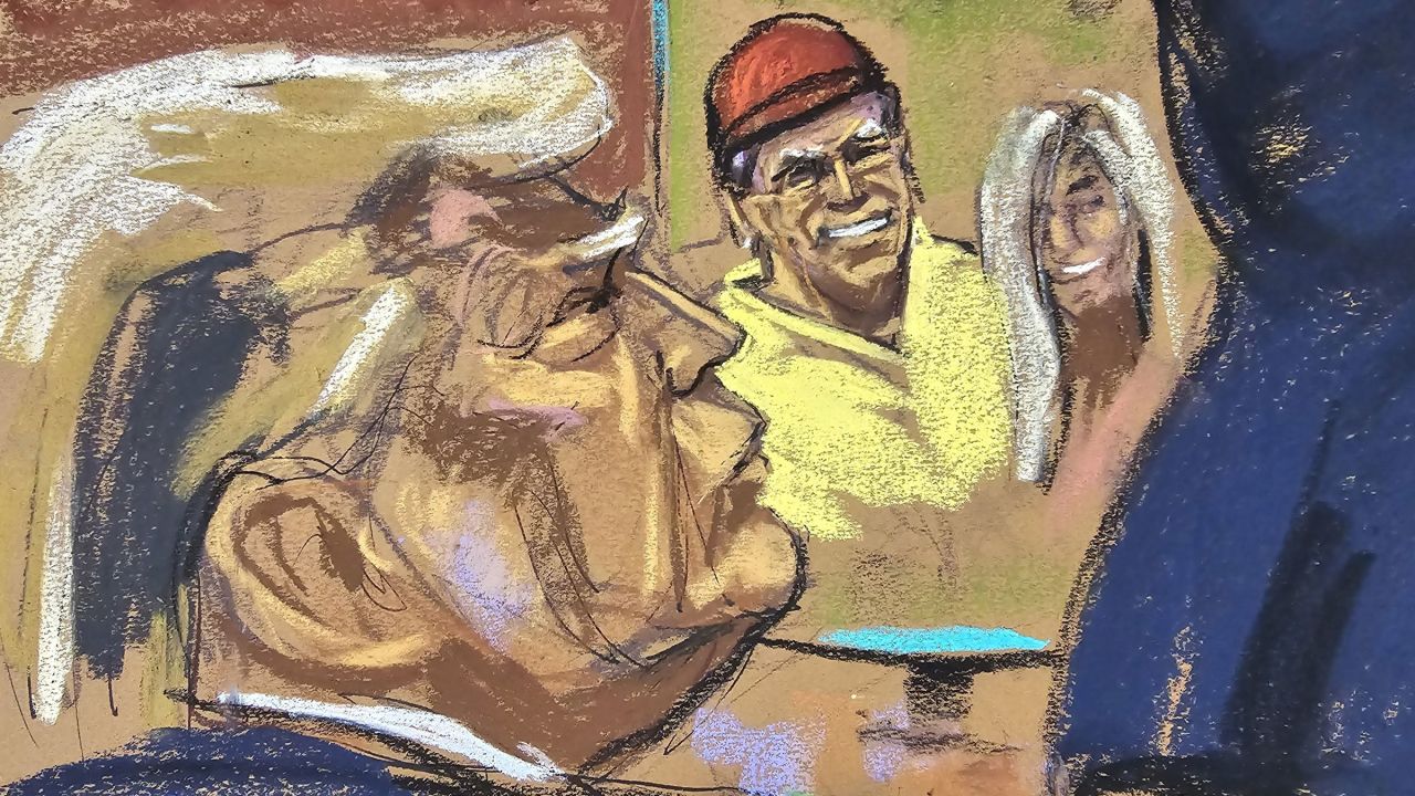 The jury on Tuesday was shown a photo of Daniels next to Trump. In the photo, he was wearing a yellow golf shirt and a red hat.