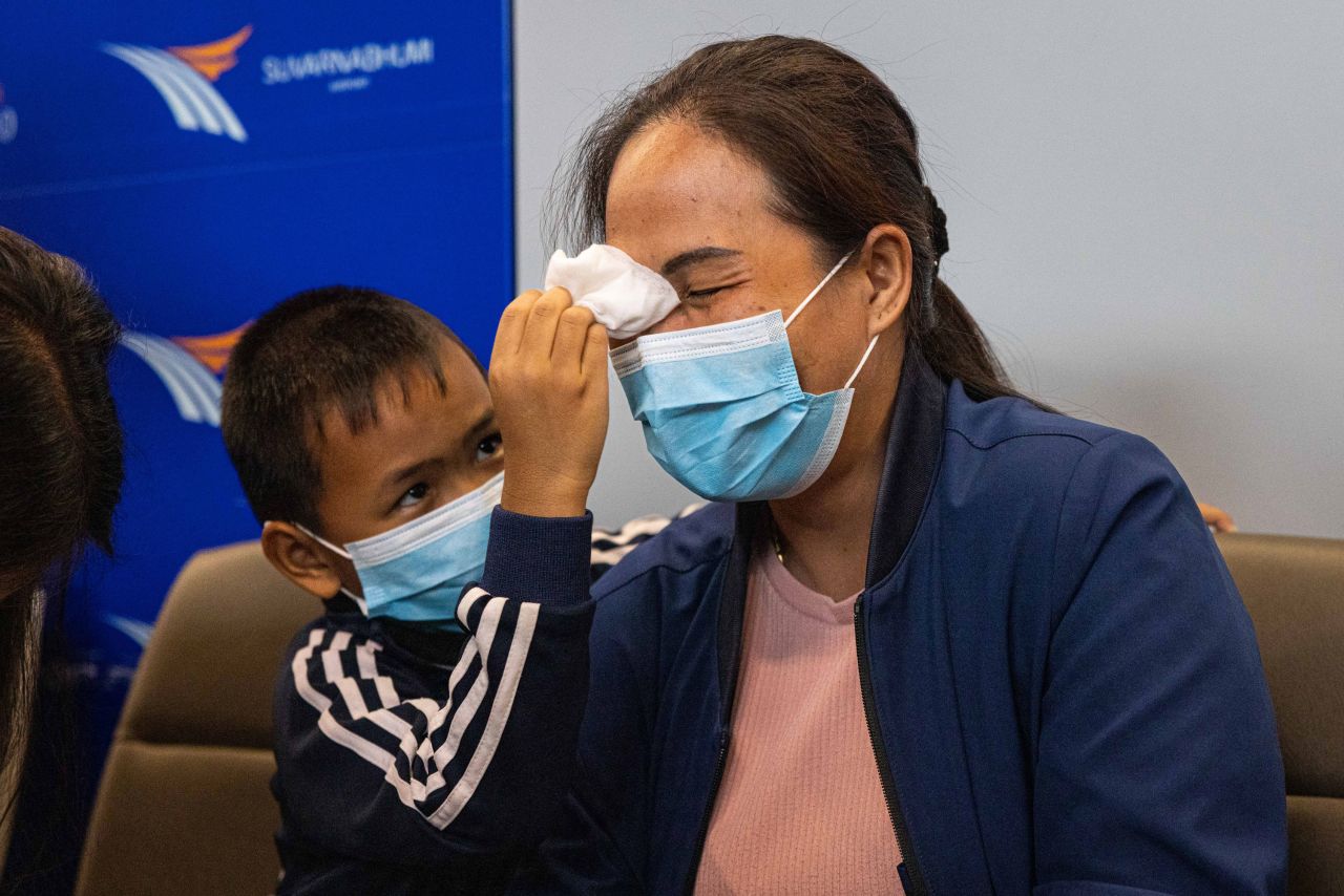 A family member of one of the Thai evacuees from Israel cries during an interview while waiting for her family member's arrival to Bangkok from Tel Aviv on October 12, 2023, in Bangkok, Thailand.