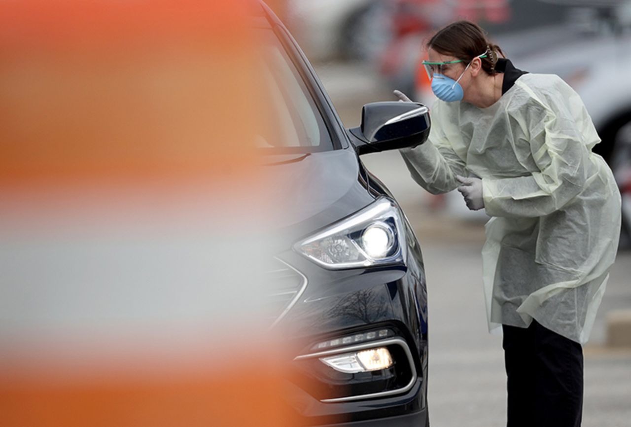 A nurse screens patients for COVID-19 virus testing at a drive-up location outside Medstar St. Mary's Hospital on  Tuesday, March 17, in Leonardtown, Maryland. 