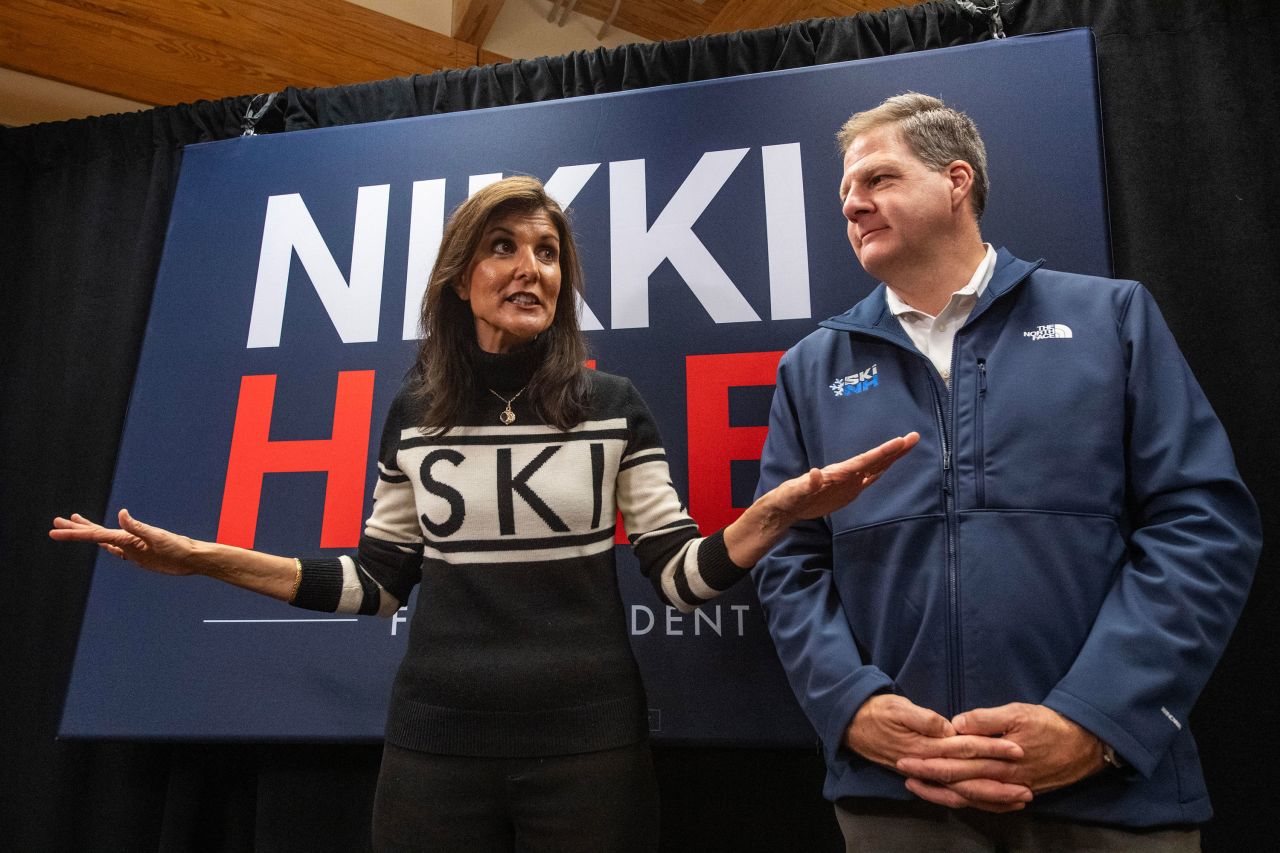 New Hampshire Governor Chris Sununu stands alongside Nikki Haley as she speaks to the press at a town hall campaign event in North Conway, New Hampshire, in December.