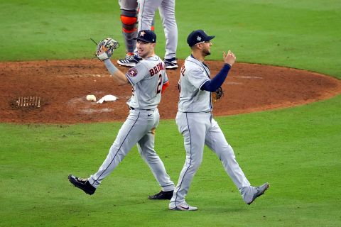 Alex Bregman and Yuli Gurriel of the Houston Astros celebrate the team's 9-5 win against the Atlanta Braves in Game 5 of the World Series on October 31 in Atlanta.