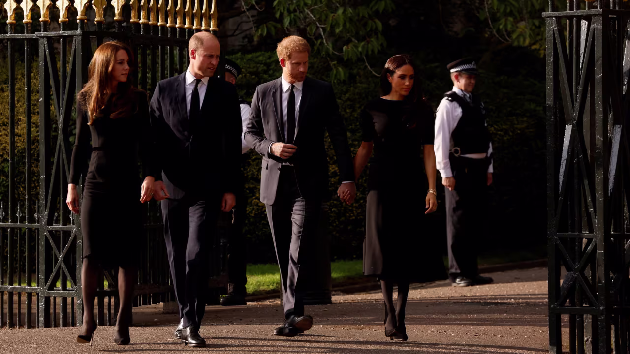 From left, Catherine, the Princess of Wales; Prince William; Prince Harry; and Meghan, the Duchess of Sussex, walk outside Windsor Castle on Saturday.