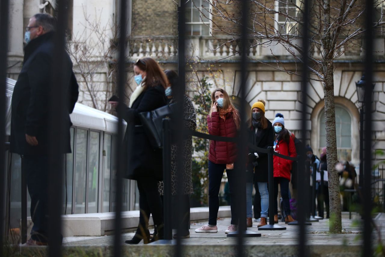 People line up for vaccinations at the NHS London Bridge Vaccination Centre 1 on December 30, 2020 in London, England.