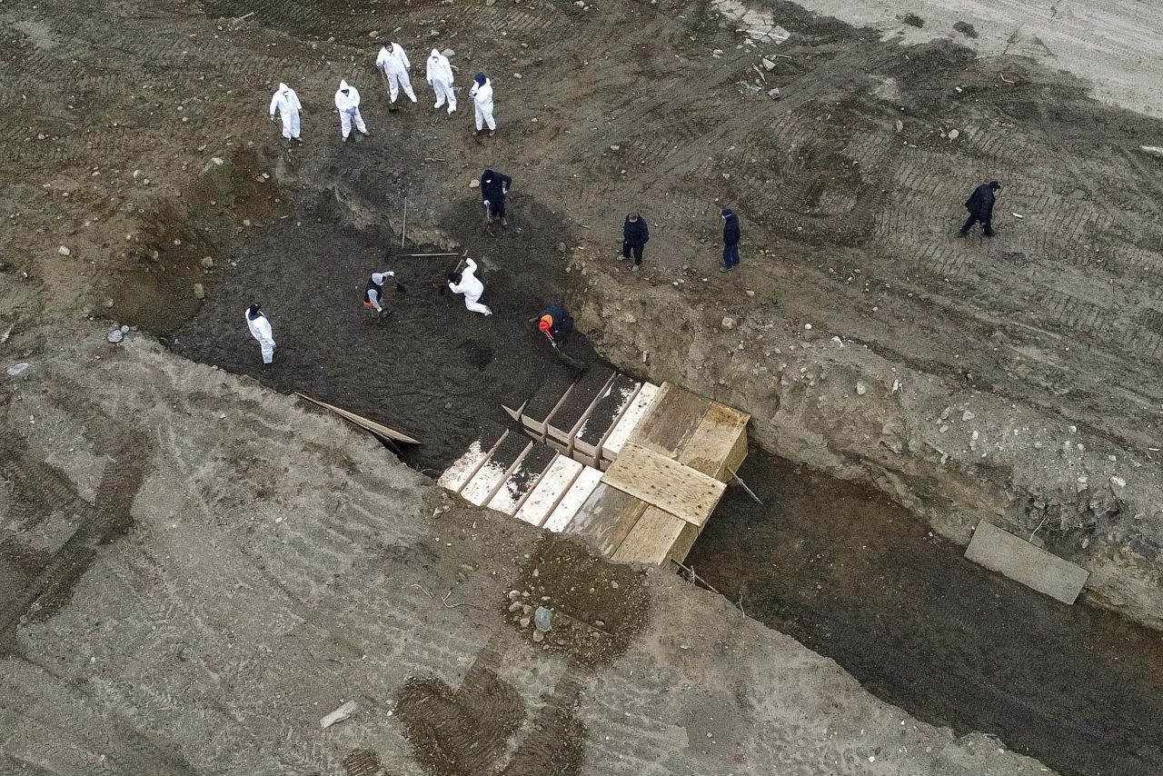 Bodies are buried on New York's Hart Island on April 9, where the Department of Corrections is dealing with more burials amid the coronavirus pandemic.