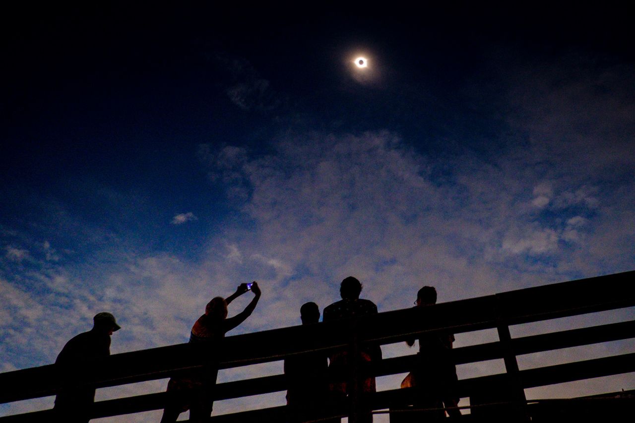 Solar eclipse watchers were ecstatic as the clouds broke minutes before totality during the total solar eclipse in Isle of Palms, South Carolina, on August 21, 2017.