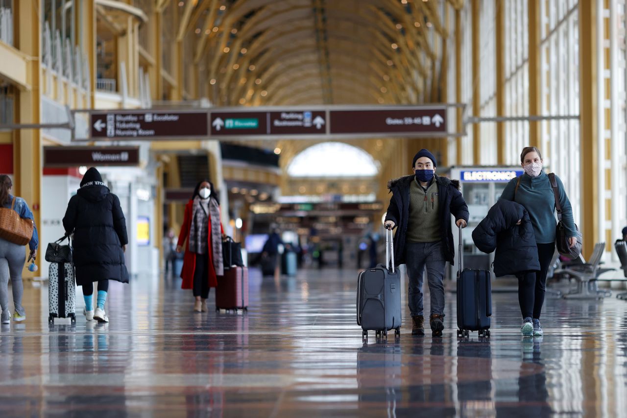 Travelers walk through Reagan National Airport in Arlington, Virginia, on February 2. 