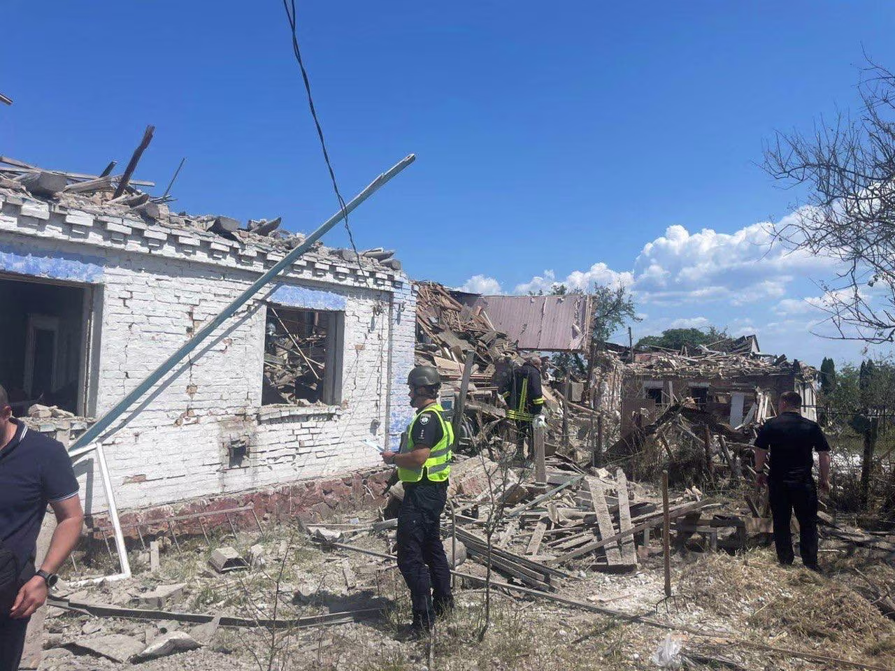 Police officers inspect at the site of a residential area hit by a Russian missile strike in Kyiv region, Ukraine, on June 16.